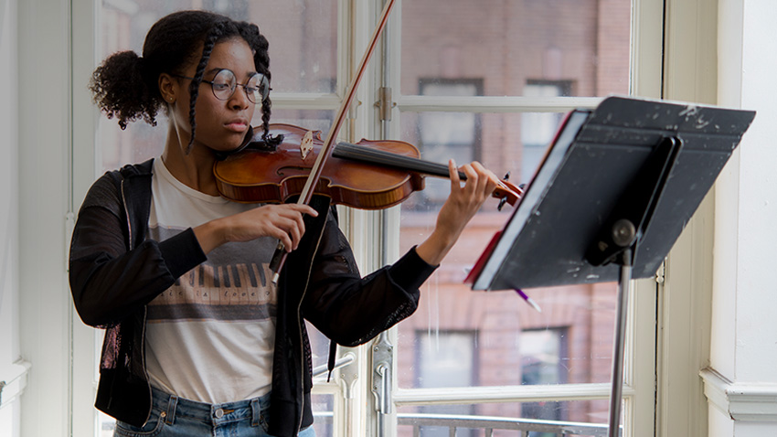 Photograph of Baltimore School for the Arts music student playing violin