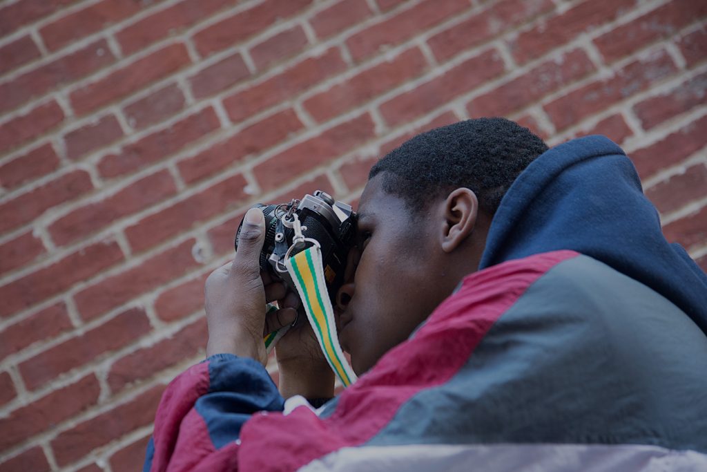 Photographs of Baltimore School for the Arts photography student taking a picture