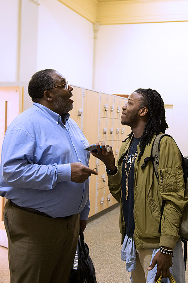 Photograph of Baltimore School for the Arts teacher talking with a student